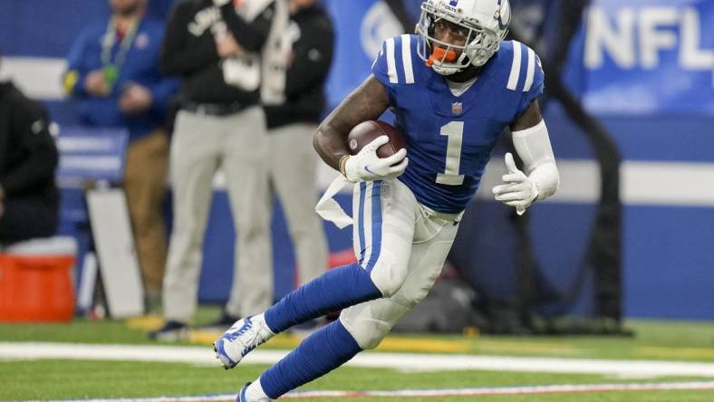 Jan 8, 2023; Indianapolis, Indiana, USA; Indianapolis Colts wide receiver Parris Campbell (1) rushes the ball after making a long reception Sunday, Jan. 8, 2023, during a game against the Houston Texans at Lucas Oil Stadium. Mandatory Credit: Jenna Watson-USA TODAY Sports