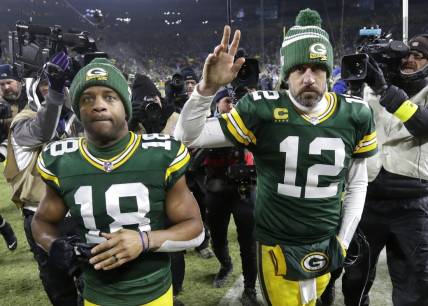 Jan 8, 2023; Green Bay, Wisconsin, USA; Green Bay Packers wide receiver Randall Cobb (18) and quarterback Aaron Rodgers (12) leave the field together after losing to the Detroit Lions at Lambeau Field. Mandatory Credit: Dan Powers/Appleton Post-Crescent via USA TODAY NETWORK