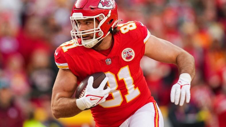 Jan 1, 2023; Kansas City, Missouri, USA; Kansas City Chiefs tight end Blake Bell (81) runs for a touchdown during the second half against the Denver Broncos at GEHA Field at Arrowhead Stadium. Mandatory Credit: Jay Biggerstaff-USA TODAY Sports