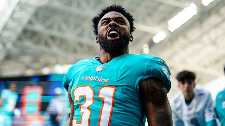 Jan 8, 2023; Miami Gardens, Florida, USA; Miami Dolphins running back Raheem Mostert (31) enters the field prior to a game against the New York Jets at Hard Rock Stadium. Mandatory Credit: Rich Storry-USA TODAY Sports