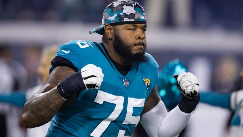 Jan 14, 2023; Jacksonville, Florida, USA; Jacksonville Jaguars offensive tackle Jawaan Taylor (75) against the Los Angeles Chargers during a wild card playoff game at TIAA Bank Field. Mandatory Credit: Mark J. Rebilas-USA TODAY Sports