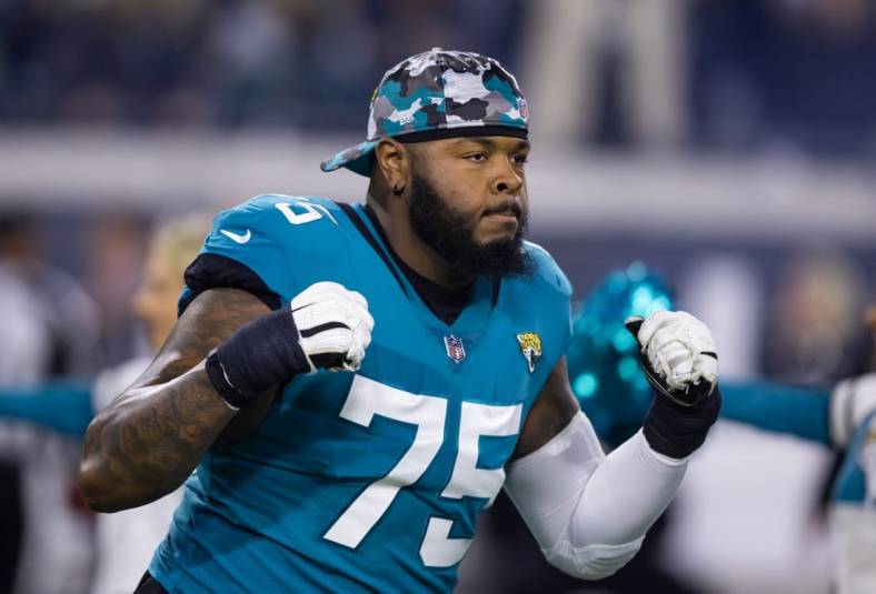Jan 14, 2023; Jacksonville, Florida, USA; Jacksonville Jaguars offensive tackle Jawaan Taylor (75) against the Los Angeles Chargers during a wild card playoff game at TIAA Bank Field. Mandatory Credit: Mark J. Rebilas-USA TODAY Sports