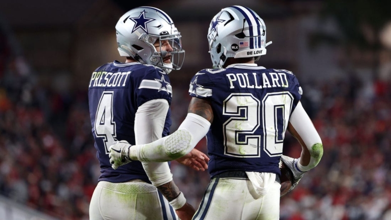 Jan 16, 2023; Tampa, Florida, USA; Dallas Cowboys running back Tony Pollard (20) reacts with quarterback Dak Prescott (4) after a touchdown against the Tampa Bay Buccaneers in the first half during the wild card game at Raymond James Stadium. Mandatory Credit: Nathan Ray Seebeck-USA TODAY Sports