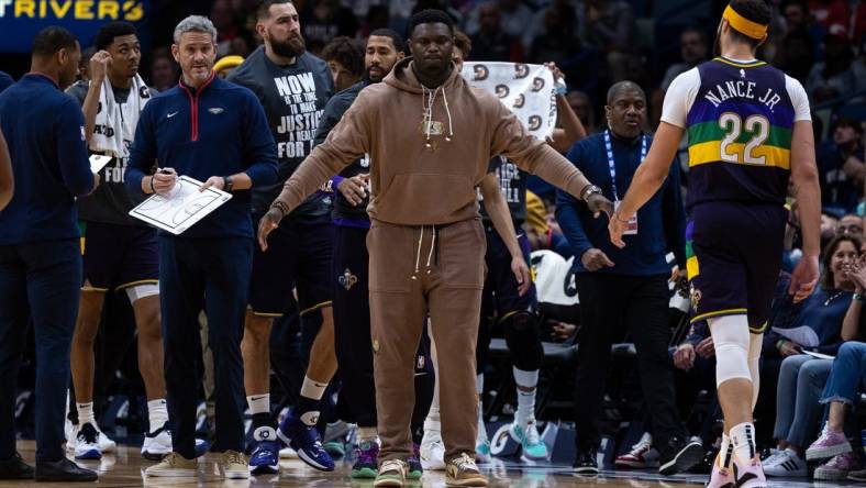 Jan 18, 2023; New Orleans, Louisiana, USA; New Orleans Pelicans forward Zion Williamson (1) meets his teammates during a time out against the Miami Heat during the first half at Smoothie King Center. Mandatory Credit: Stephen Lew-USA TODAY Sports