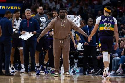Jan 18, 2023; New Orleans, Louisiana, USA; New Orleans Pelicans forward Zion Williamson (1) meets his teammates during a time out against the Miami Heat during the first half at Smoothie King Center. Mandatory Credit: Stephen Lew-USA TODAY Sports