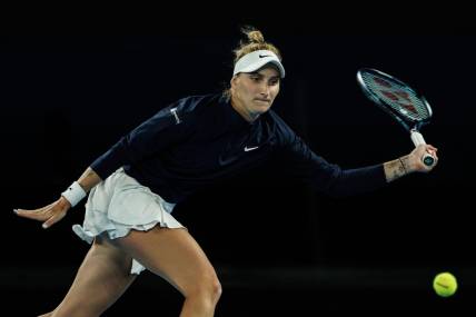 Jan 19, 2023; Melbourne, Victoria, Australia;  Marketa Vondrousova of the Czech Republic hits a shot against Ons Jabeur of Tunisia on day four of the 2023 Australian Open tennis tournament at Melbourne Park. Mandatory Credit: Mike Frey-USA TODAY Sports