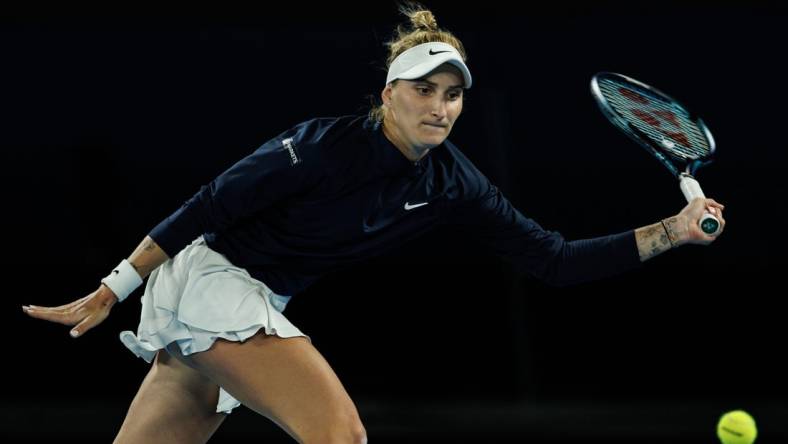 Jan 19, 2023; Melbourne, Victoria, Australia;  Marketa Vondrousova of the Czech Republic hits a shot against Ons Jabeur of Tunisia on day four of the 2023 Australian Open tennis tournament at Melbourne Park. Mandatory Credit: Mike Frey-USA TODAY Sports