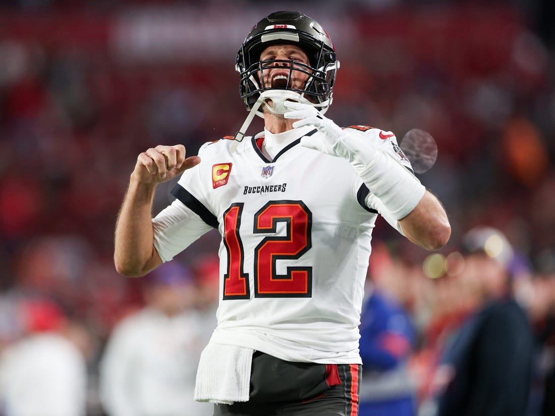 Jan 16, 2023; Tampa, Florida, USA; Tampa Bay Buccaneers quarterback Tom Brady (12) takes the field before a wild card game against the Dallas Cowboys at Raymond James Stadium. Mandatory Credit: Nathan Ray Seebeck-USA TODAY Sports