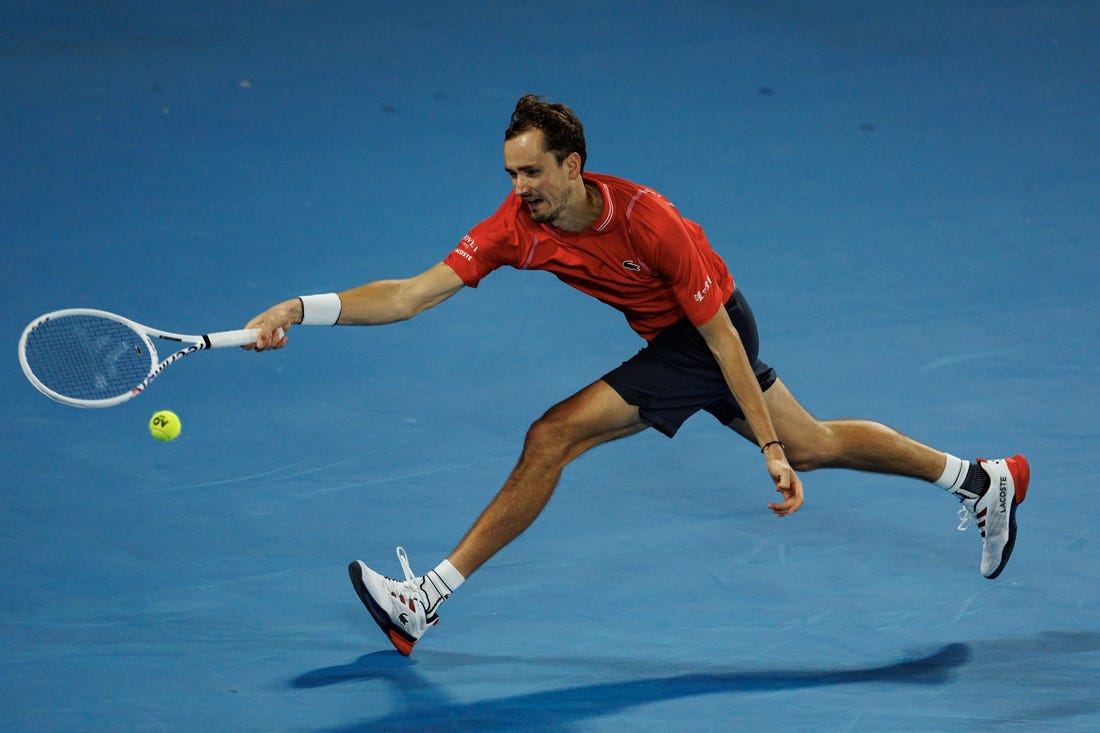 Jan 20, 2023; Melbourne, Victoria, Australia; Daniil Medvedev of Russia hits a shot against Sebastian Korda of the United States on day five of the 2023 Australian Open tennis tournament at Melbourne Park. Mandatory Credit: Mike Frey-USA TODAY Sports