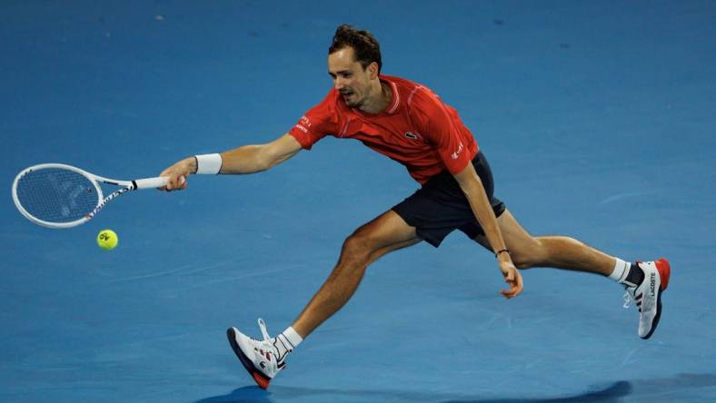 Jan 20, 2023; Melbourne, Victoria, Australia; Daniil Medvedev of Russia hits a shot against Sebastian Korda of the United States on day five of the 2023 Australian Open tennis tournament at Melbourne Park. Mandatory Credit: Mike Frey-USA TODAY Sports