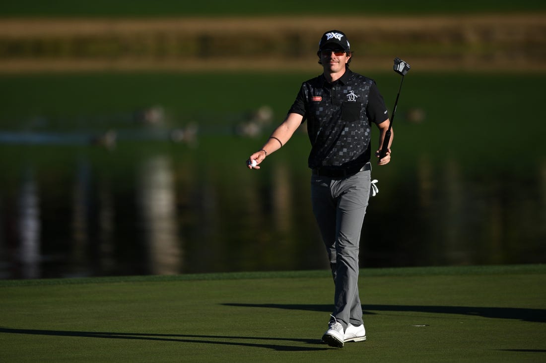 Jan 21, 2023; La Quinta, California, USA; Nico Echavarria acknowledges the crowd after a putt on the ninth green during the third round of The American Express golf tournament at Pete Dye Stadium Course. Mandatory Credit: Orlando Ramirez-USA TODAY Sports