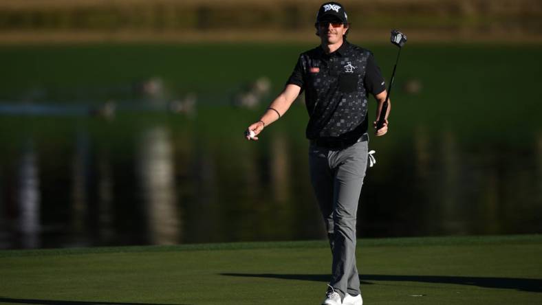 Jan 21, 2023; La Quinta, California, USA; Nico Echavarria acknowledges the crowd after a putt on the ninth green during the third round of The American Express golf tournament at Pete Dye Stadium Course. Mandatory Credit: Orlando Ramirez-USA TODAY Sports