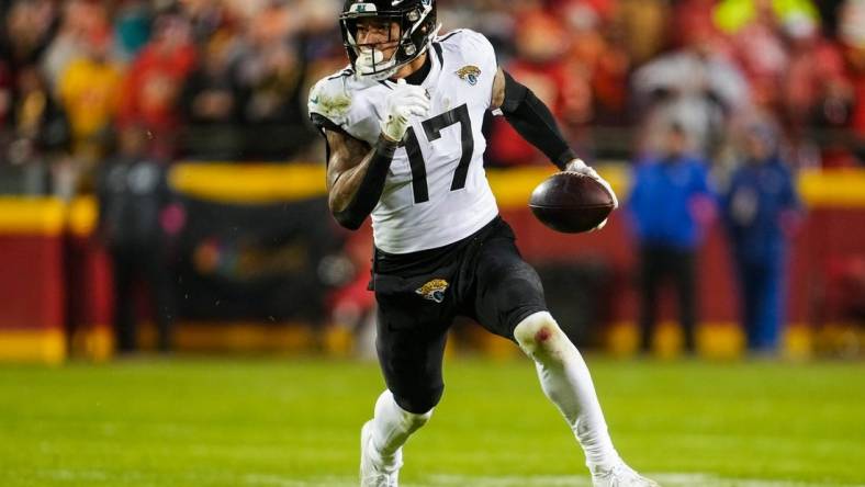 Jan 21, 2023; Kansas City, Missouri, USA; Jacksonville Jaguars tight end Evan Engram (17) runs with the ball during the second half of an AFC divisional round game against the Kansas City Chiefs at GEHA Field at Arrowhead Stadium. Mandatory Credit: Jay Biggerstaff-USA TODAY Sports