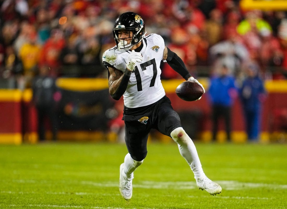 Jan 21, 2023; Kansas City, Missouri, USA; Jacksonville Jaguars tight end Evan Engram (17) runs with the ball during the second half of an AFC divisional round game against the Kansas City Chiefs at GEHA Field at Arrowhead Stadium. Mandatory Credit: Jay Biggerstaff-USA TODAY Sports