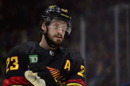 Jan 24, 2023; Vancouver, British Columbia, CAN;  Vancouver Canucks defenseman Oliver Ekman-Larsson (23) awaits the start of play against the Chicago Blackhawks during the second period at Rogers Arena. Mandatory Credit: Anne-Marie Sorvin-USA TODAY Sports