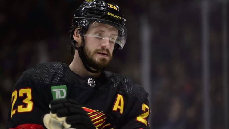 Jan 24, 2023; Vancouver, British Columbia, CAN;  Vancouver Canucks defenseman Oliver Ekman-Larsson (23) awaits the start of play against the Chicago Blackhawks during the second period at Rogers Arena. Mandatory Credit: Anne-Marie Sorvin-USA TODAY Sports