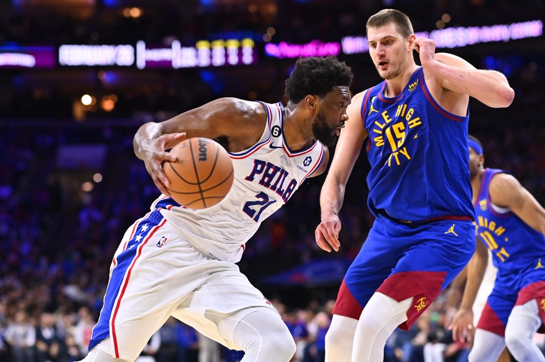 Jan 28, 2023; Philadelphia, Pennsylvania, USA; Philadelphia 76ers center Joel Embiid (21) drives against Denver Nuggets center Nikola Jokic (15) in the third quarter at Wells Fargo Center. Mandatory Credit: Kyle Ross-USA TODAY Sports