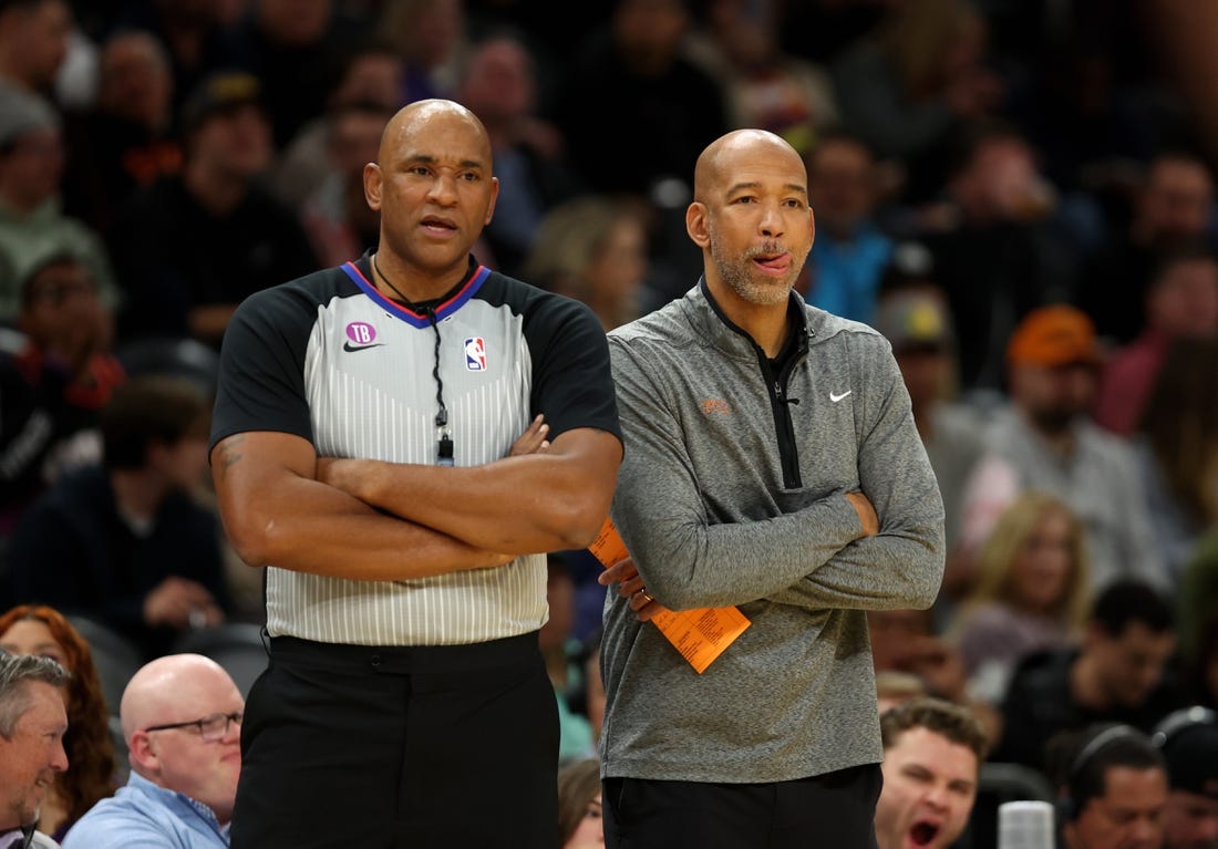 Jan 19, 2023; Phoenix, Arizona, USA; Phoenix Suns head coach Monty Williams (right) alongside NBA referee Kevin Cutler against the Brooklyn Nets at Footprint Center. Mandatory Credit: Mark J. Rebilas-USA TODAY Sports