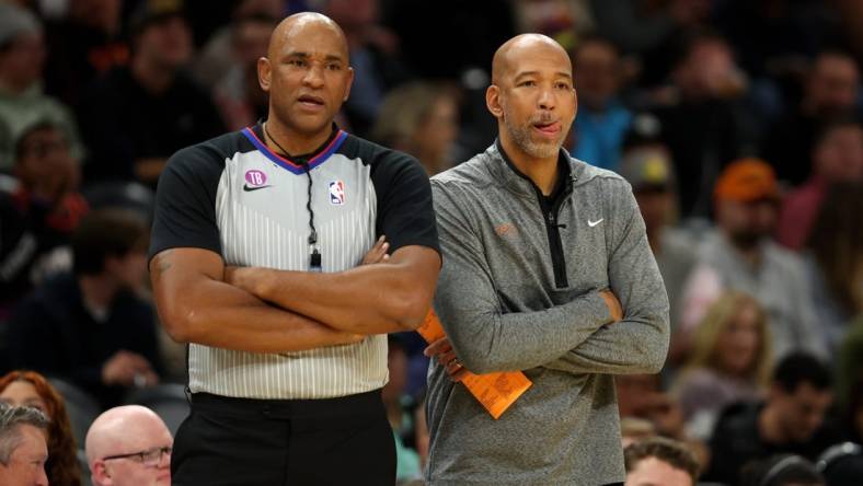 Jan 19, 2023; Phoenix, Arizona, USA; Phoenix Suns head coach Monty Williams (right) alongside NBA referee Kevin Cutler against the Brooklyn Nets at Footprint Center. Mandatory Credit: Mark J. Rebilas-USA TODAY Sports