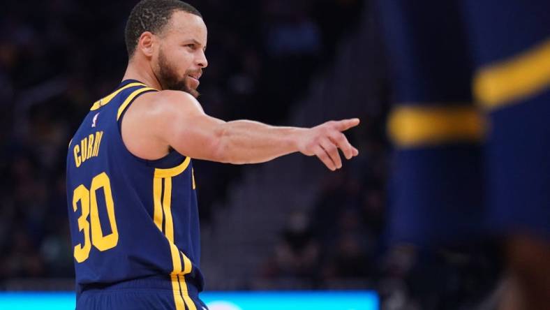 Feb 4, 2023; San Francisco, California, USA; Golden State Warriors guard Stephen Curry (30) directs teammates before a play against the Dallas Mavericks in the third quarter at the Chase Center. Mandatory Credit: Cary Edmondson-USA TODAY Sports