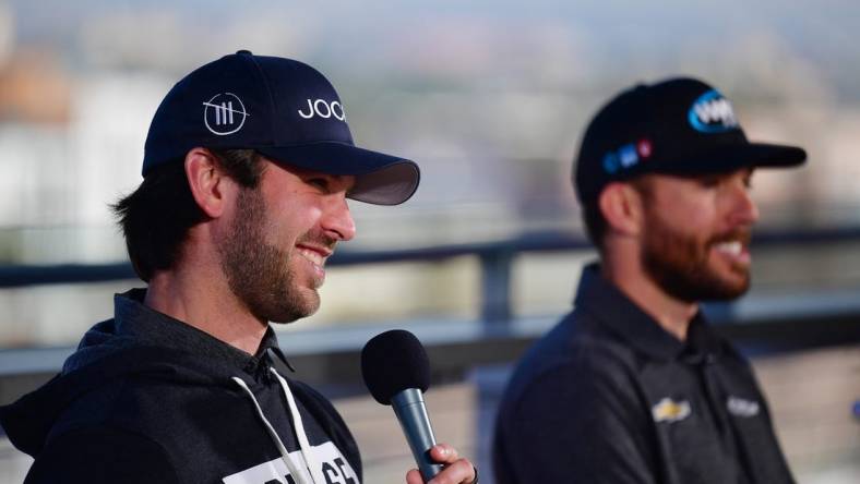 Feb 4, 2023; Los Angeles, California, USA; NASCAR Cup Series driver Daniel Suarez (99) and driver Ross Chastain (1) during media availabilities before practice for the Busch Light Clash at Los Angeles Memorial Coliseum. Mandatory Credit: Gary A. Vasquez-USA TODAY Sports