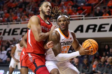Oklahoma State Cowboys forward Tyreek Smith (23) tries to get past Texas Tech Red Raiders forward Kevin Obanor (0) during a men's college basketball game between the Oklahoma State University Cowboys (OSU) and the Texas Tech Red Raiders at Gallagher-Iba Arena in Stillwater, Okla., Wednesday, Feb. 8, 2023. Oklahoma State won 71-68.

Osu Vs Texas Tech Men S Basketball