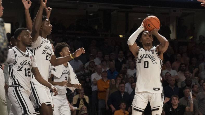 Feb 8, 2023; Nashville, Tennessee, USA;   Vanderbilt Commodores guard Tyrin Lawrence (0) shoots a three point basket at the buzzer to defeat the Tennessee Volunteers 66 to 65 at Memorial Gymnasium.  Mandatory Credit: George Walker IV - USA TODAY Sports