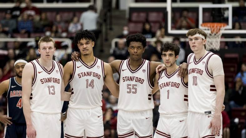 Feb 11, 2023; Stanford, California, USA; Stanford Cardinal guard Michael Jones (13) and forward Spencer Jones (14) and forward Harrison Ingram (55) and guard Isa Silva (1) and forward Max Murrell (10) watch a free-throw by Arizona Wildcats center Oumar Ballo (not seen) during the second half at Maples Pavilion. Mandatory Credit: John Hefti-USA TODAY Sports