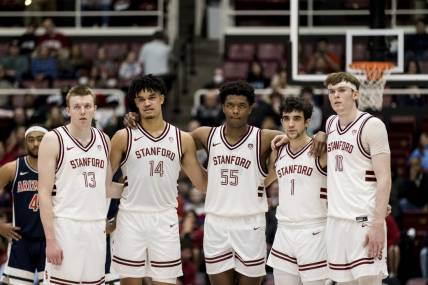 Feb 11, 2023; Stanford, California, USA; Stanford Cardinal guard Michael Jones (13) and forward Spencer Jones (14) and forward Harrison Ingram (55) and guard Isa Silva (1) and forward Max Murrell (10) watch a free-throw by Arizona Wildcats center Oumar Ballo (not seen) during the second half at Maples Pavilion. Mandatory Credit: John Hefti-USA TODAY Sports