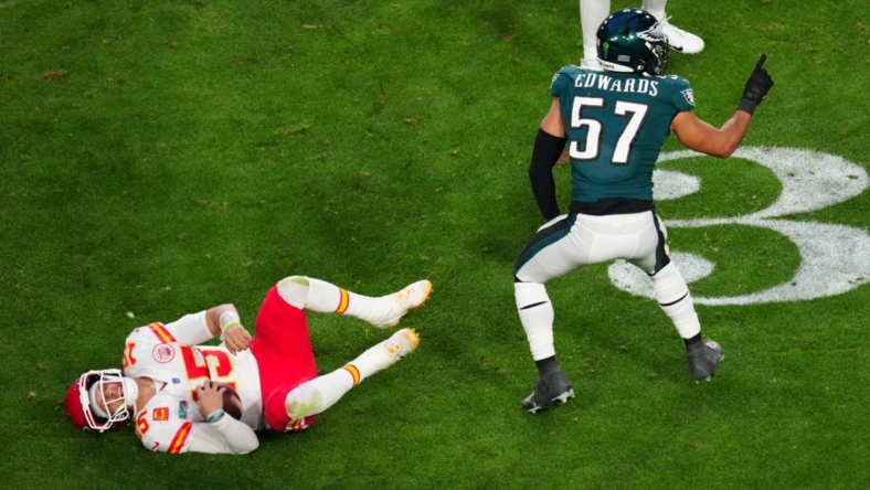 Kansas City Chiefs quarterback Patrick Mahomes (15) lies on the turf after being tackled by Philadelphia Eagles linebacker T.J. Edwards (57) during the second quarter in Super Bowl LVII at State Farm Stadium in Glendale on Feb. 12, 2023.

Nfl Super Bowl Lvii Kansas City Chiefs Vs Philadelphia Eagles