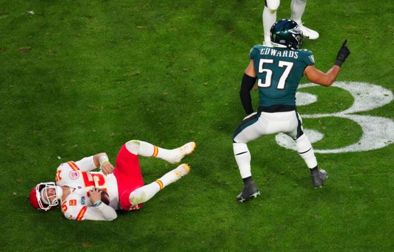 Kansas City Chiefs quarterback Patrick Mahomes (15) lies on the turf after being tackled by Philadelphia Eagles linebacker T.J. Edwards (57) during the second quarter in Super Bowl LVII at State Farm Stadium in Glendale on Feb. 12, 2023.

Nfl Super Bowl Lvii Kansas City Chiefs Vs Philadelphia Eagles