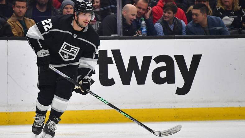 Feb 13, 2023; Los Angeles, California, USA; Los Angeles Kings left wing Kevin Fiala (22) controls the puck against the Buffalo Sabres during the second period at Crypto.com Arena. Mandatory Credit: Gary A. Vasquez-USA TODAY Sports