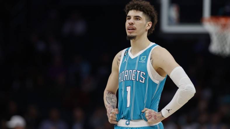 Feb 15, 2023; Charlotte, North Carolina, USA; Charlotte Hornets guard LaMelo Ball (1) stands on the court during the second half against the San Antonio Spurs at Spectrum Center. The Charlotte Hornets won 120-110. Mandatory Credit: Nell Redmond-USA TODAY Sports