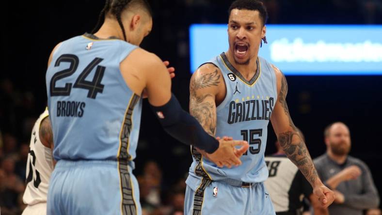 Feb 15, 2023; Memphis, Tennessee, USA; Memphis Grizzlies forward Brandon Clarke (15) reacts with forward Dillon Brooks (24) after forcing a turnover during the second half at FedExForum. Mandatory Credit: Petre Thomas-USA TODAY Sports