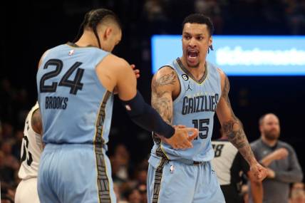 Feb 15, 2023; Memphis, Tennessee, USA; Memphis Grizzlies forward Brandon Clarke (15) reacts with forward Dillon Brooks (24) after forcing a turnover during the second half at FedExForum. Mandatory Credit: Petre Thomas-USA TODAY Sports
