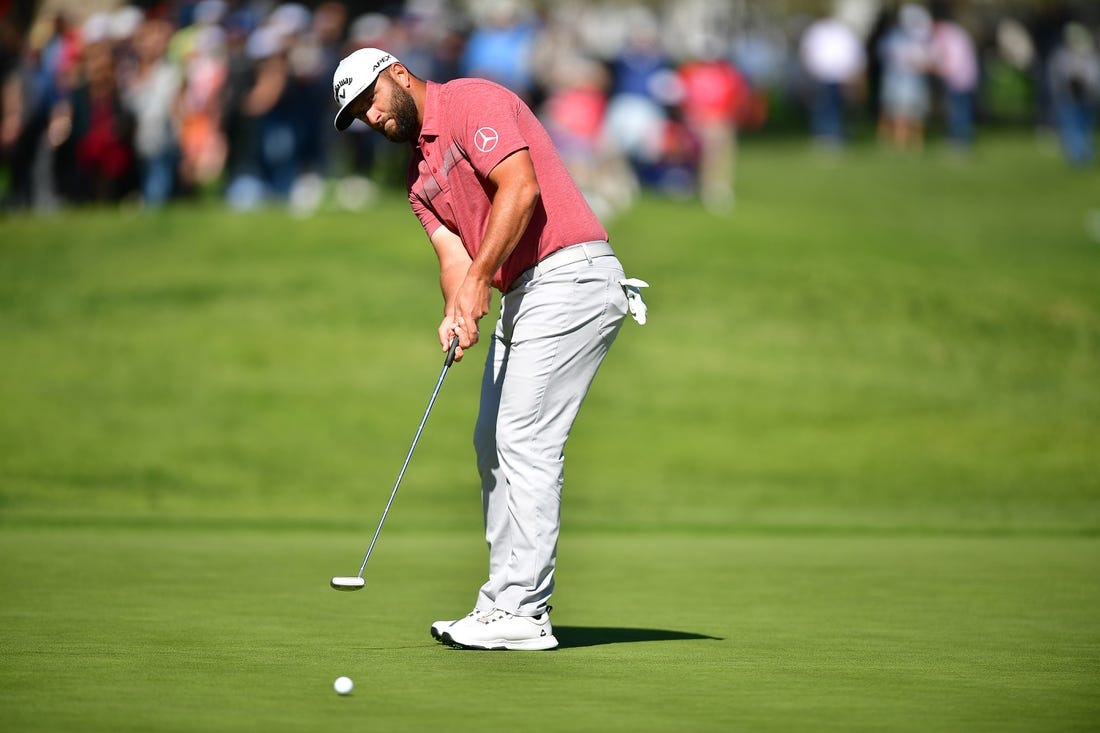 Feb 19, 2023; Pacific Palisades, California, USA; Jon Rahm putts on thirteenth green during the final round of The Genesis Invitational golf tournament. Mandatory Credit: Gary A. Vasquez-USA TODAY Sports