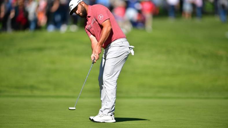 Feb 19, 2023; Pacific Palisades, California, USA; Jon Rahm putts on thirteenth green during the final round of The Genesis Invitational golf tournament. Mandatory Credit: Gary A. Vasquez-USA TODAY Sports