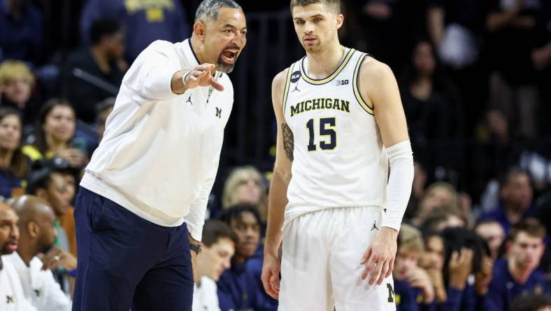 Feb 23, 2023; Piscataway, New Jersey, USA; Michigan Wolverines head coach Juwan Howard talks with guard Joey Baker (15) during the first half against the Rutgers Scarlet Knights at Jersey Mike's Arena. Mandatory Credit: Vincent Carchietta-USA TODAY Sports