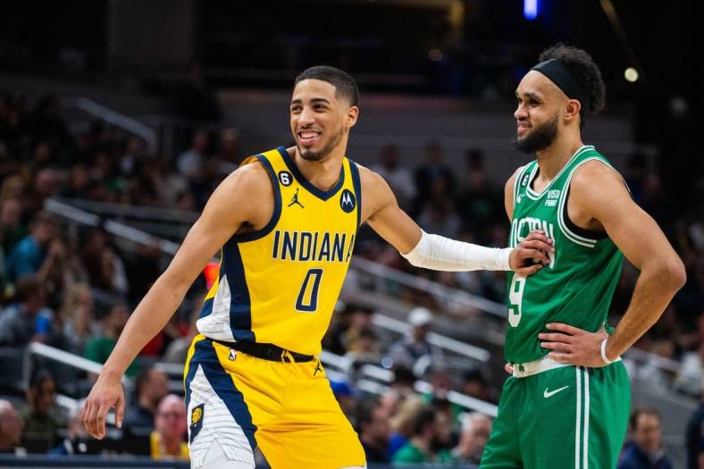 Feb 23, 2023; Indianapolis, Indiana, USA; Indiana Pacers guard Tyrese Haliburton (0) and Boston Celtics guard Derrick White (9) in the second half at Gainbridge Fieldhouse. Mandatory Credit: Trevor Ruszkowski-USA TODAY Sports
