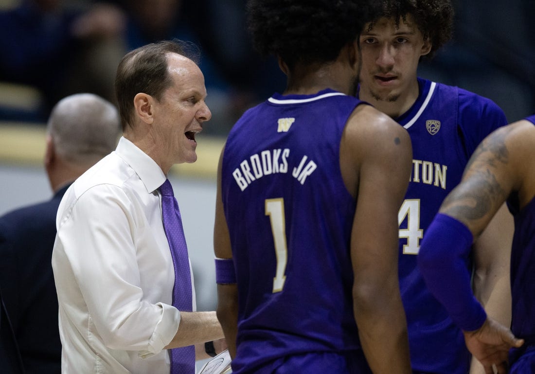 Feb 23, 2023; Berkeley, California, USA; Washington Huskies head coach Mike Hopkins confers with his team during a time out in the second half against the California Golden Bears at Haas Pavilion. Mandatory Credit: D. Ross Cameron-USA TODAY Sports