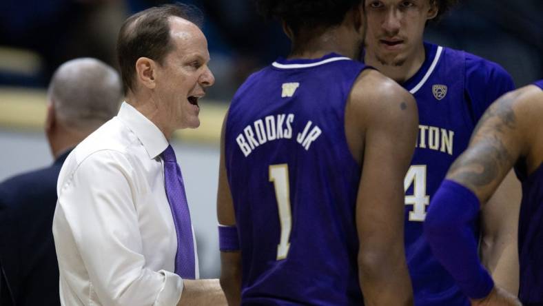 Feb 23, 2023; Berkeley, California, USA; Washington Huskies head coach Mike Hopkins confers with his team during a time out in the second half against the California Golden Bears at Haas Pavilion. Mandatory Credit: D. Ross Cameron-USA TODAY Sports