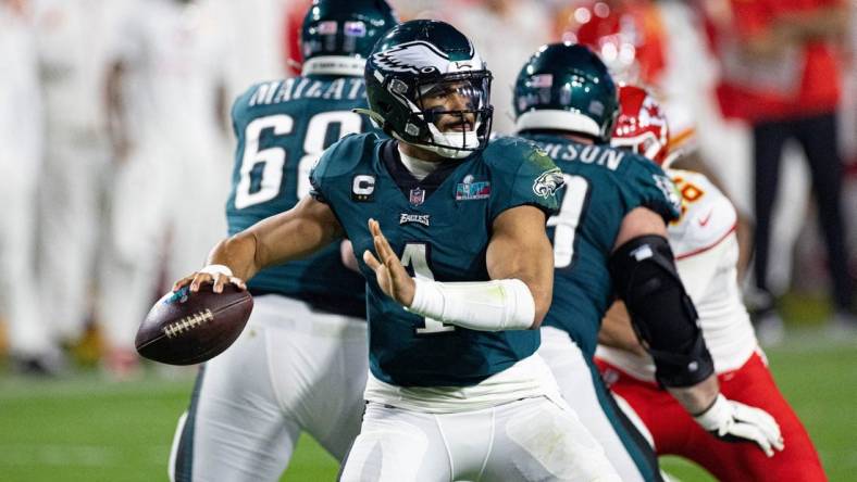 Feb 12, 2023; Glendale, Arizona, US; Philadelphia Eagles quarterback Jalen Hurts (1) throws the ball against the Kansas City Chiefs in Super Bowl LVII at State Farm Stadium. Mandatory Credit: Bill Streicher-USA TODAY Sports