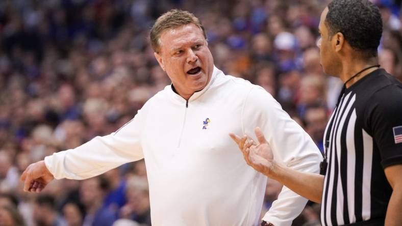 Feb 25, 2023; Lawrence, Kansas, USA; Kansas Jayhawks head coach Bill Self talks with an official against the West Virginia Mountaineers during the first half at Allen Fieldhouse. Mandatory Credit: Denny Medley-USA TODAY Sports