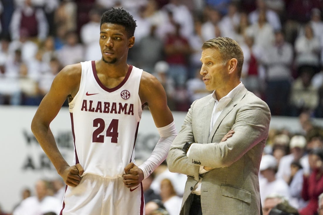 Feb 25, 2023; Tuscaloosa, Alabama, USA; Alabama Crimson Tide forward Brandon Miller (24) talks to head coach Nate Oats during the second half against the Arkansas Razorbacks at Coleman Coliseum. Mandatory Credit: Marvin Gentry-USA TODAY Sports