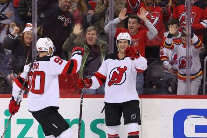 Feb 25, 2023; Newark, New Jersey, USA; New Jersey Devils center Dawson Mercer (91) celebrates his goal against the Philadelphia Flyers during the second period at Prudential Center. Mandatory Credit: Ed Mulholland-USA TODAY Sports