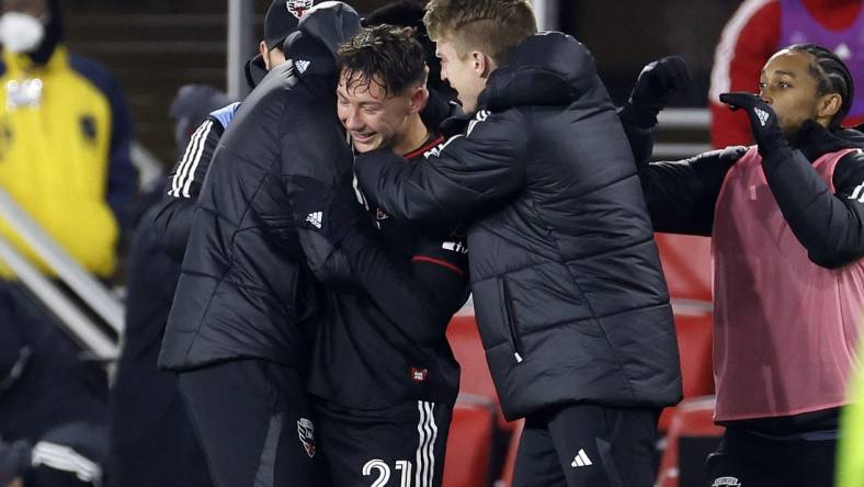 Feb 25, 2023; Washington, District of Columbia, USA; D.C. United forward Theodore Ku-Dipietro (21) reacts after scoring a goal against Toronto FC during the second half at Audi Field. Mandatory Credit: Geoff Burke-USA TODAY Sports