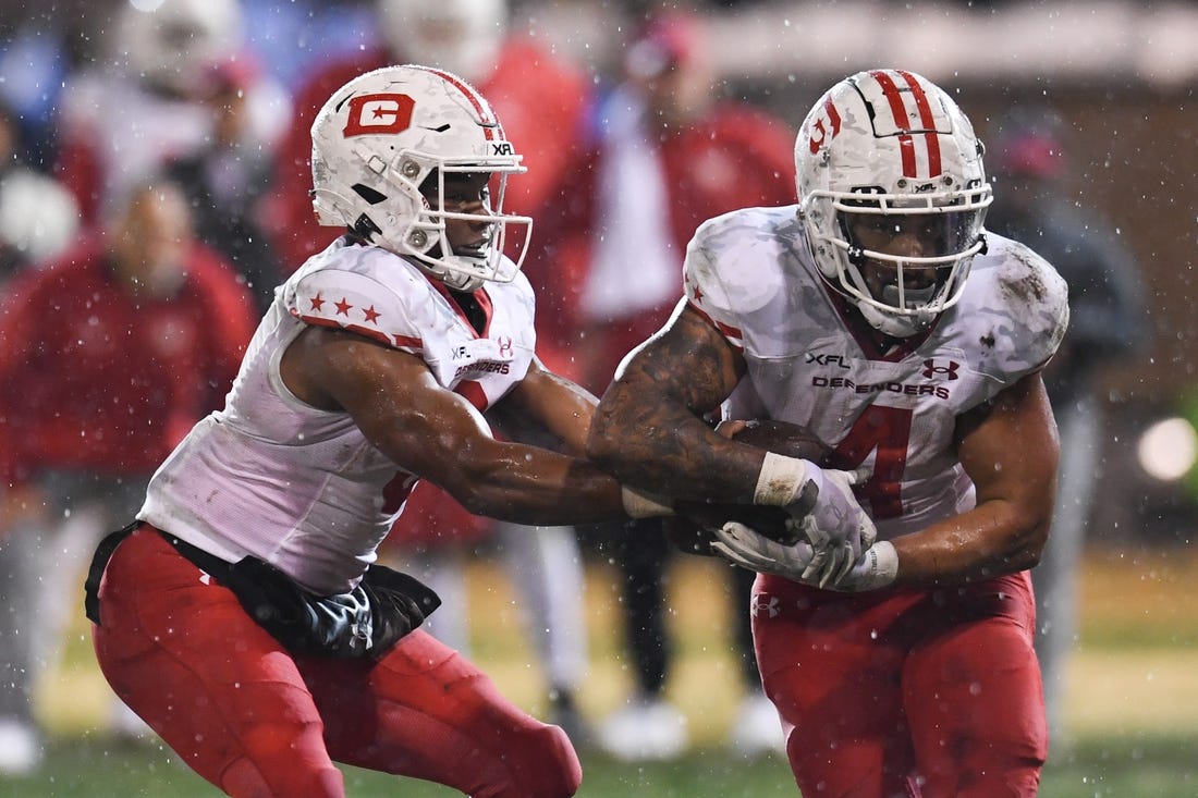 Feb 25, 2023; Las Vegas, NV, USA; D.C. Defenders quarterback D'Eriq King (3) hands the ball off to running back Abram Smith (4) against the Vegas Vipers in the fourth quarter at Cashman Field. Mandatory Credit: Candice Ward-USA TODAY Sports