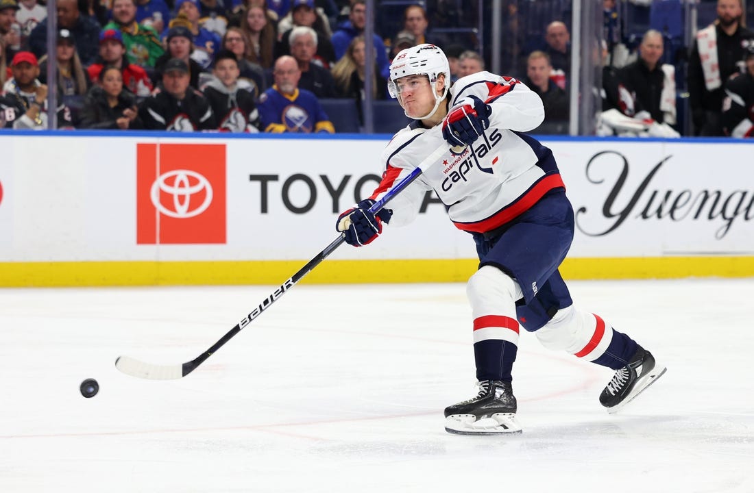 Feb 26, 2023; Buffalo, New York, USA;  Washington Capitals right wing Nicolas Aube-Kubel (96) takes a shot on goal during the first period against the Buffalo Sabres at KeyBank Center. Mandatory Credit: Timothy T. Ludwig-USA TODAY Sports