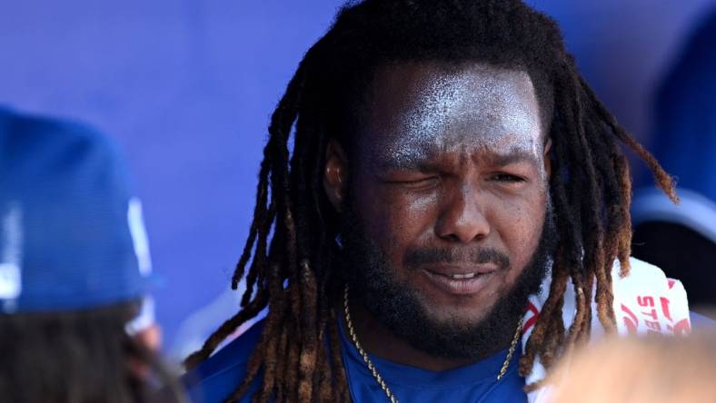 Feb 26, 2023; Dunedin, Florida, USA; Toronto Blue Jays designated hitter Vladimir Guerrero Jr. (27) applies sunscreen before the start of the game against the New York Yankees at TD Ballpark. Mandatory Credit: Jonathan Dyer-USA TODAY Sports