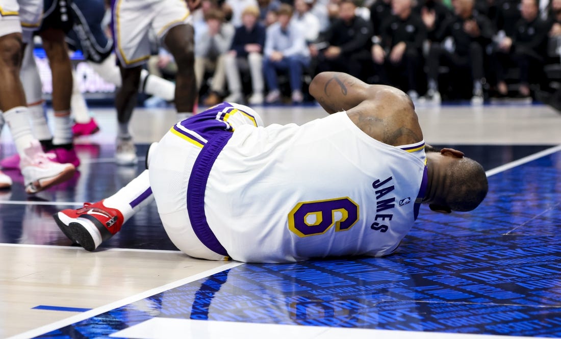 Feb 26, 2023; Dallas, Texas, USA; Los Angeles Lakers forward LeBron James (6) lays on the floor injured during the second half against the Dallas Mavericks at American Airlines Center. Mandatory Credit: Kevin Jairaj-USA TODAY Sports